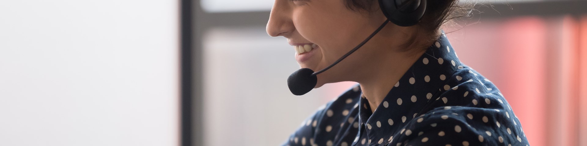Smiling woman answering sale calls